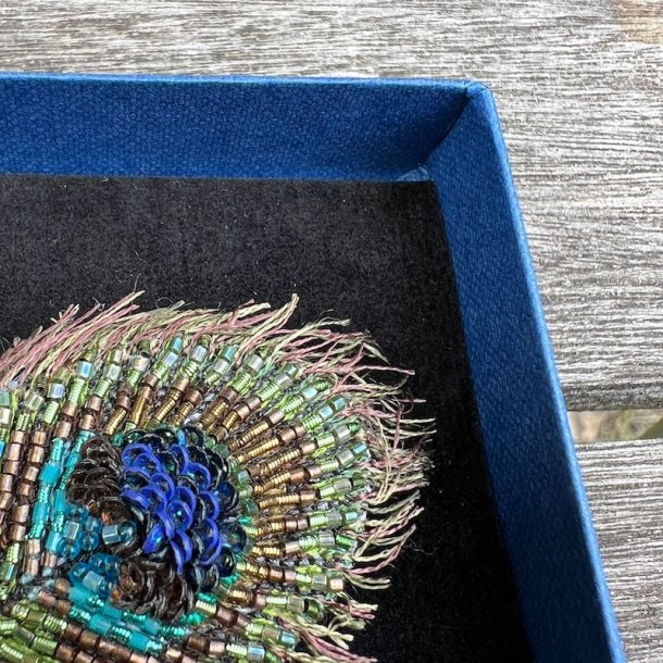 Peacock feather broche